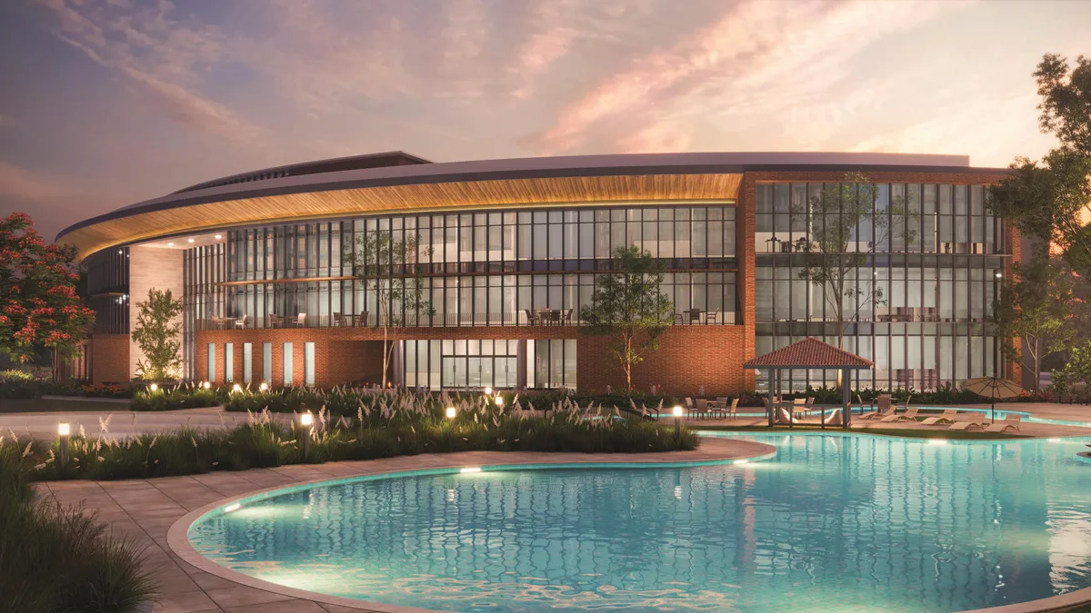 Clubhouse and swimming pool at dusk — developer artist impression