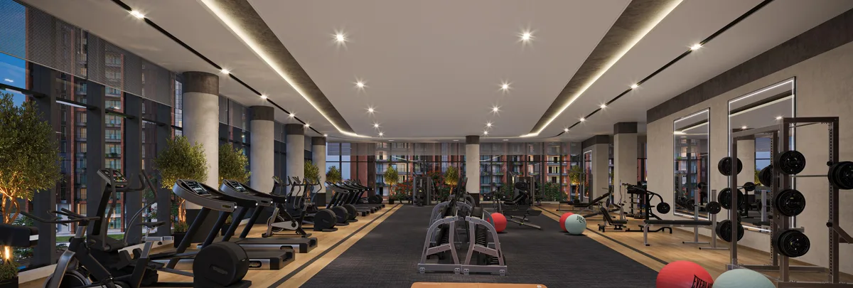 Clubhouse gym with cardio equipment and weight machines — developer artist impression